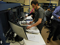 Photo of a student in a lab.