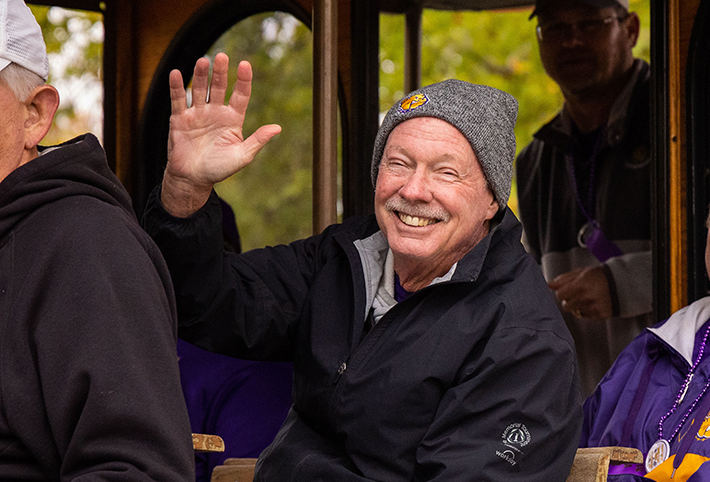 A man smiling and waving. Link to Gifts of Retirement Plans.