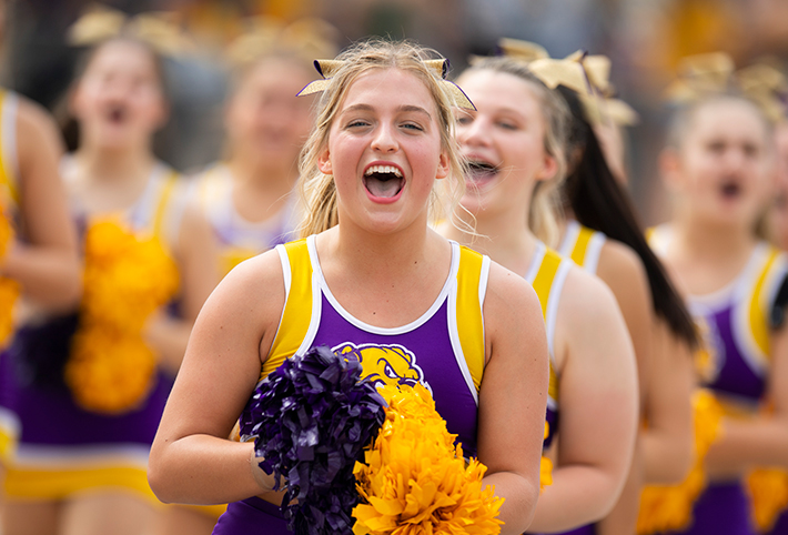 A cheerleader smiling. Links to Gifts by Will